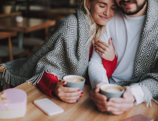 Cozy couple drinking coffee