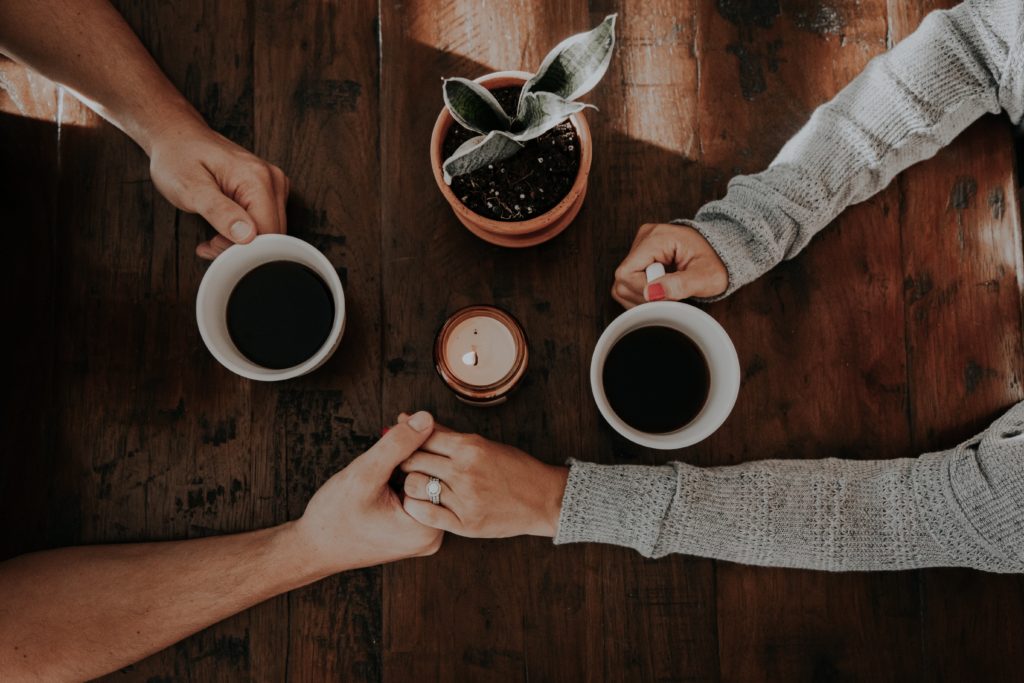 couple embracing over coffee