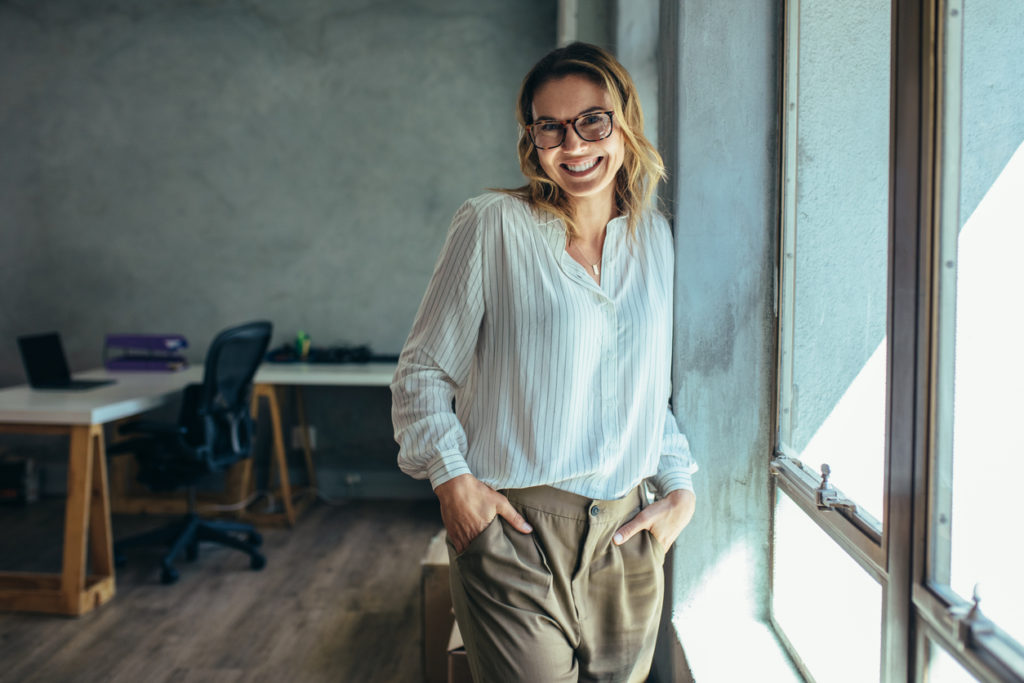 woman smiling in an office