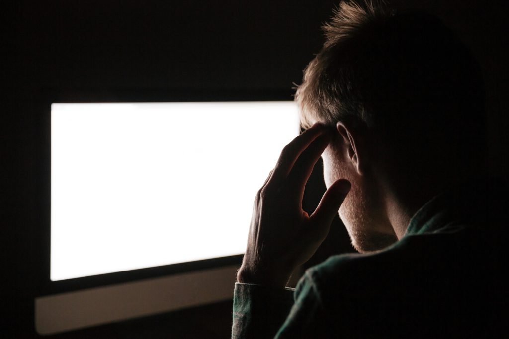 back-view-of-thoughtful-young-man-thinking-and-using-blank-screen-computer-in-the-dark-SBI-302849298_50_1_50-1024x683.jpg