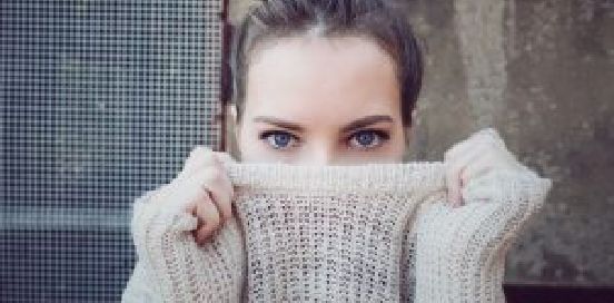 woman stretching sweater