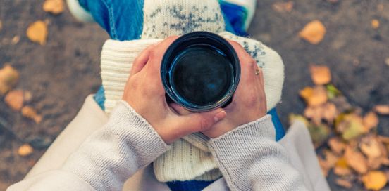 woman holding a cup of coffee
