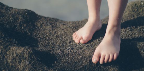 feet on a beach
