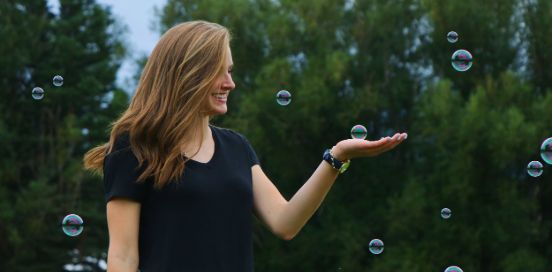 woman playing with bubbles
