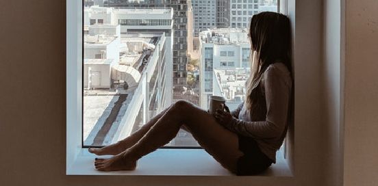 sitting in the window sill