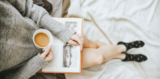 girl reading and drinking coffee