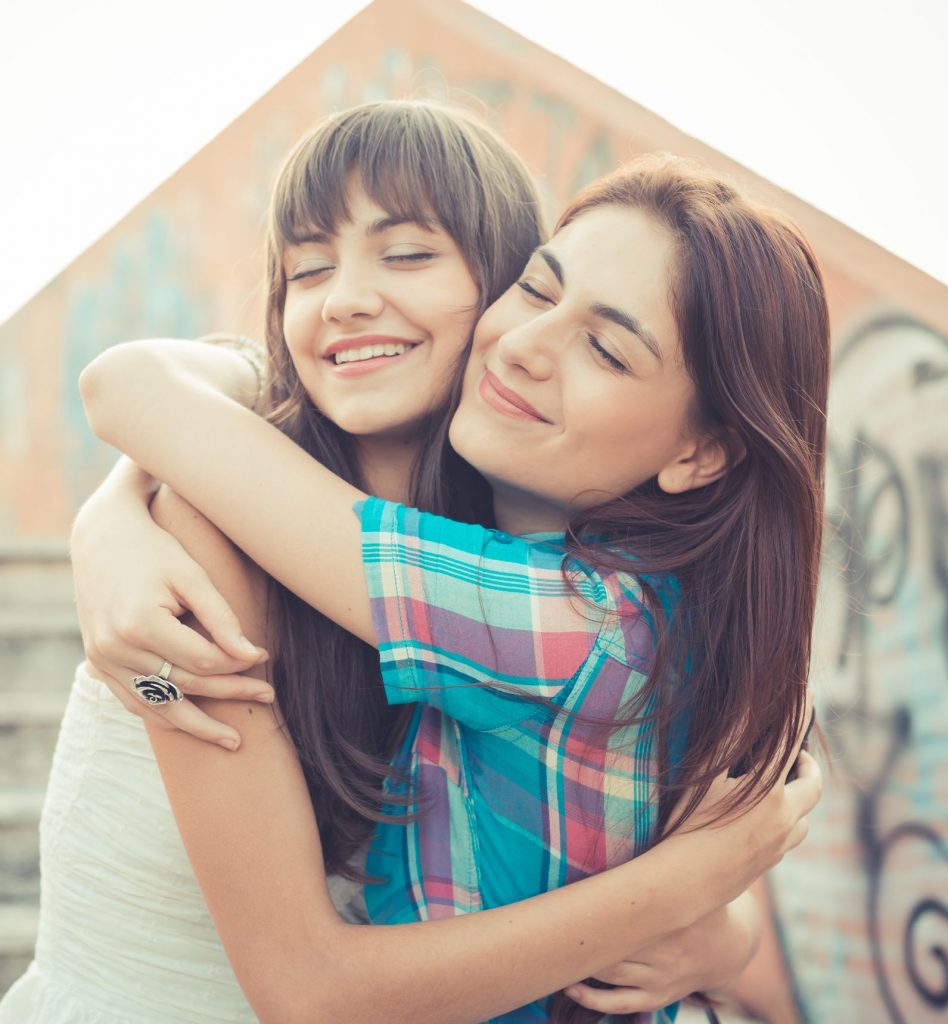 sisters hugging