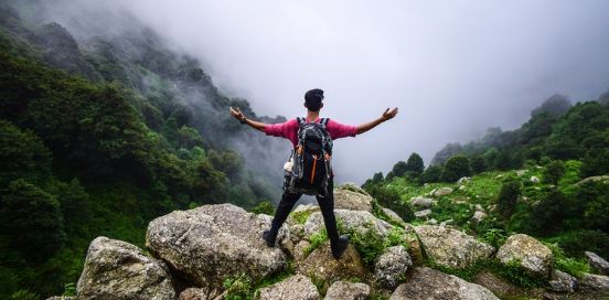 man at the top of a hike
