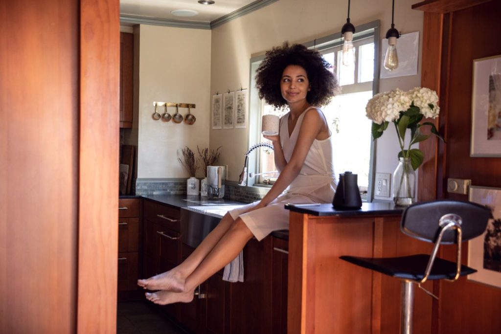 Young woman spending a relaxing day in her beautiful home