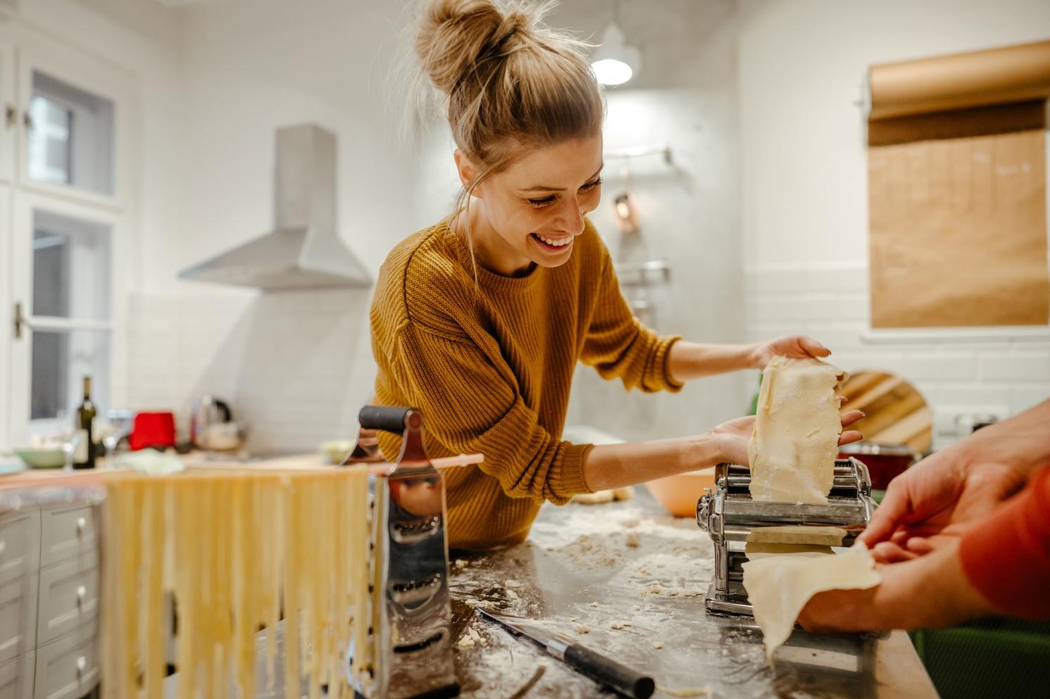 Photo of a woman making homemade pasta