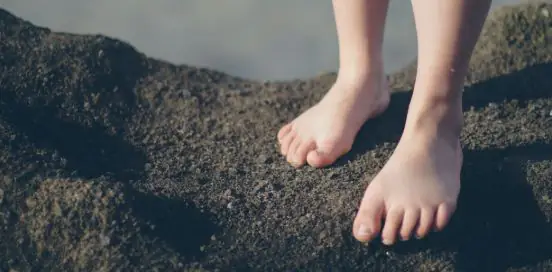 feet on a beach
