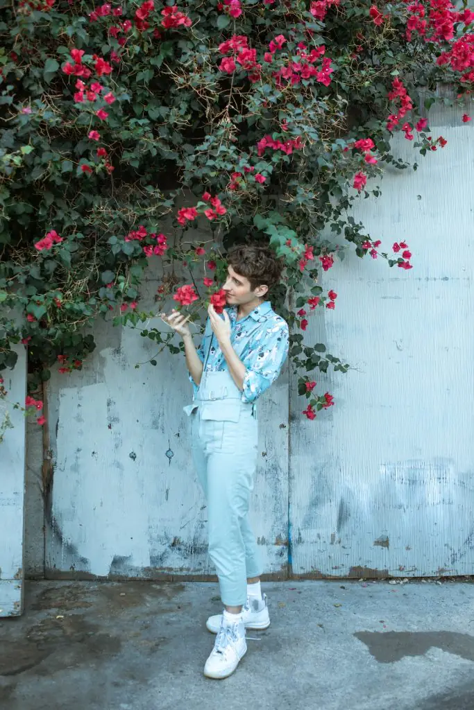 person smelling flowers